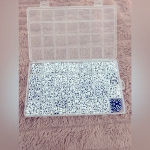 alphabet bracelet beads, comes with hearts and evil eye beads. Has not been used